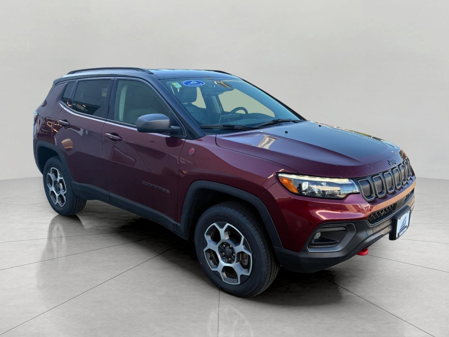 2022 Jeep Compass Trailhawk 4x4 in Velvet Red Pearlcoat — front three-quarter view