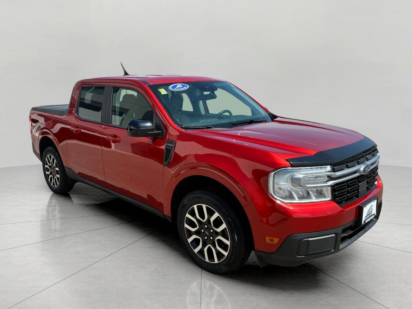 2024 Ford Maverick LARIAT AWD SuperCrew in Hot Pepper Red Metallic Tinted Clearcoat — front three-quarter view