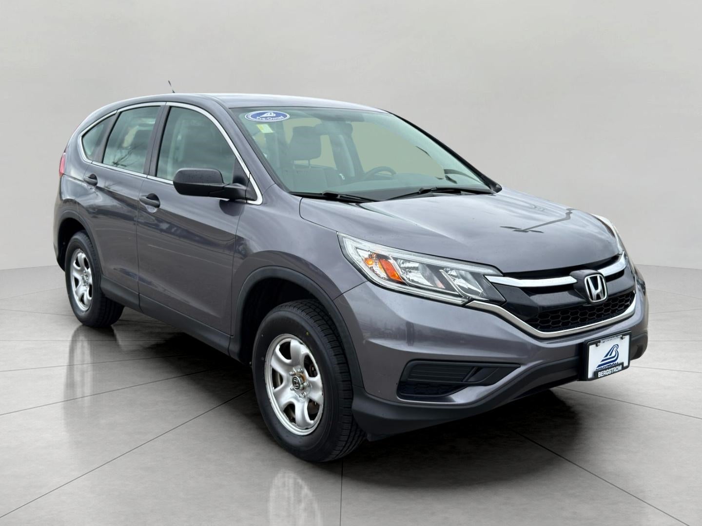 2016 Honda CR-V AWD 5dr LX in Alabaster Silver Metallic — front three-quarter view
