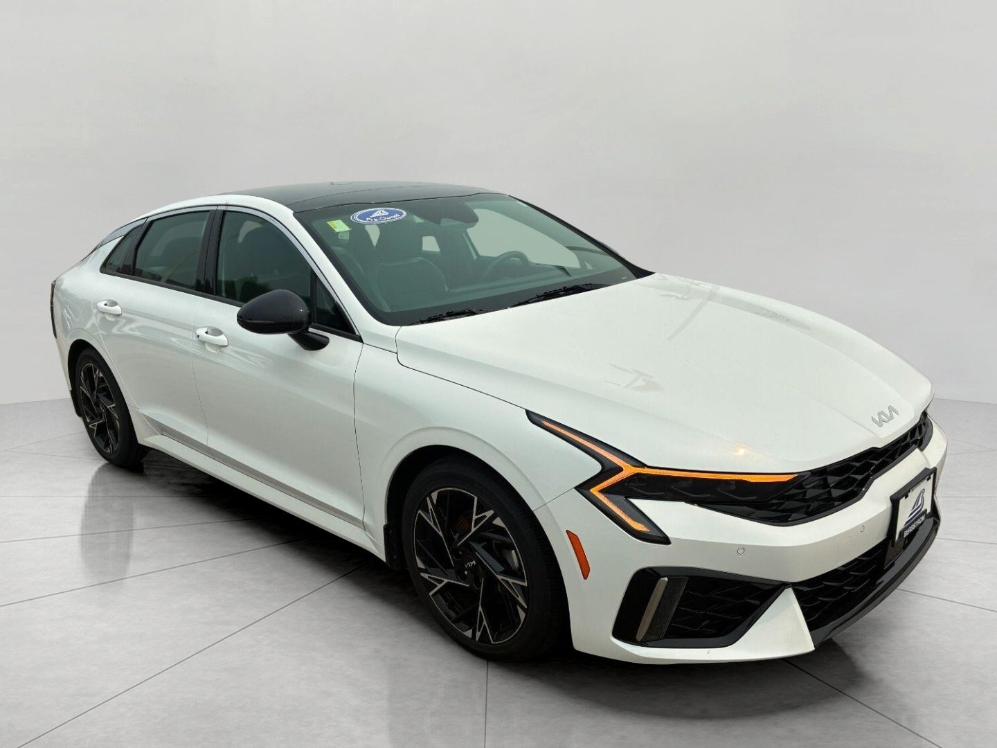 2025 Kia K5 GT-Line Auto AWD in Snow White Pearl — front three-quarter view
